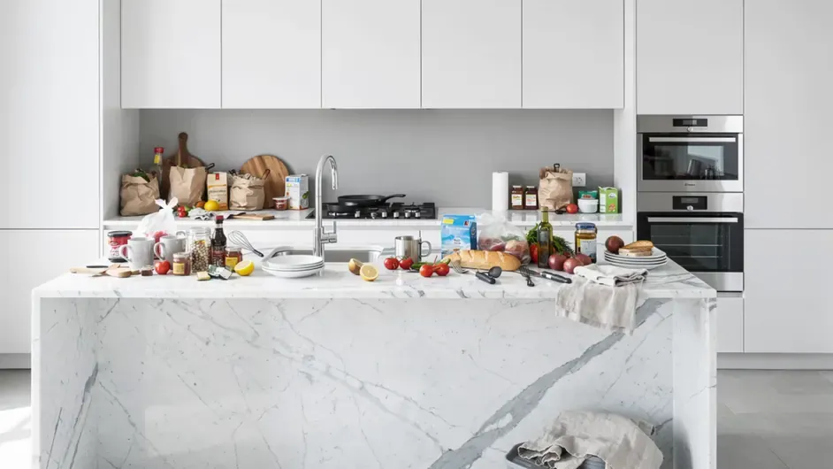 A cluttered real estate listing photo with furniture and objects removed by AI in seconds — a clean, distraction-free result, no physical cleaning.